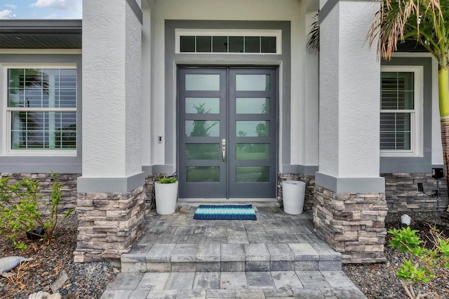 property entrance featuring french doors