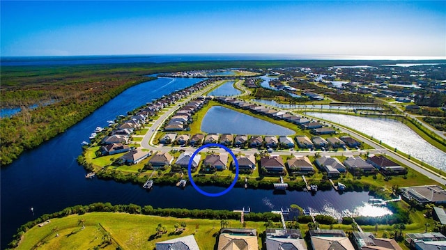 birds eye view of property featuring a water view