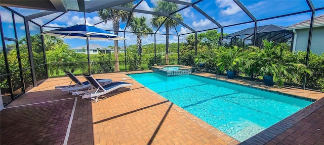 view of pool with an in ground hot tub, a lanai, and a patio area