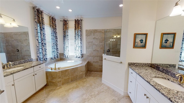 bathroom featuring crown molding, vanity, and shower with separate bathtub