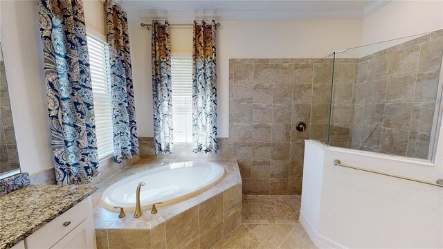 bathroom with vanity, tile patterned flooring, and plus walk in shower