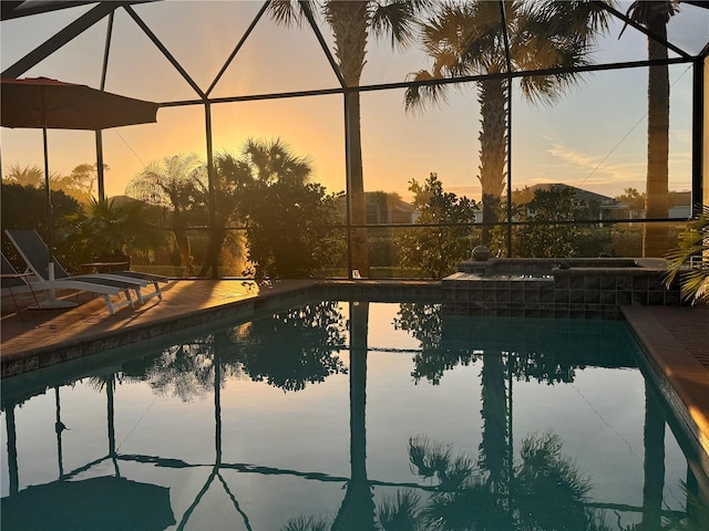 pool at dusk with glass enclosure