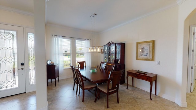 tiled dining space with crown molding