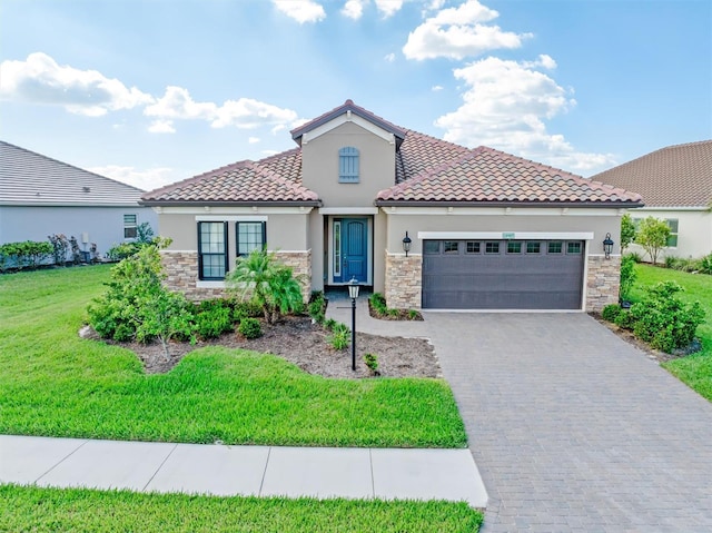 mediterranean / spanish-style house featuring a front lawn and a garage