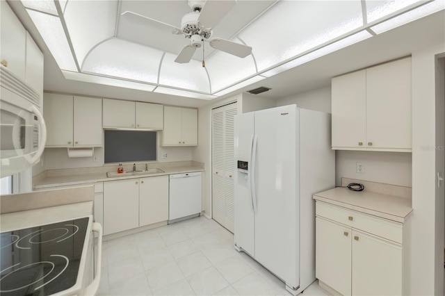 kitchen featuring ceiling fan, sink, and white appliances