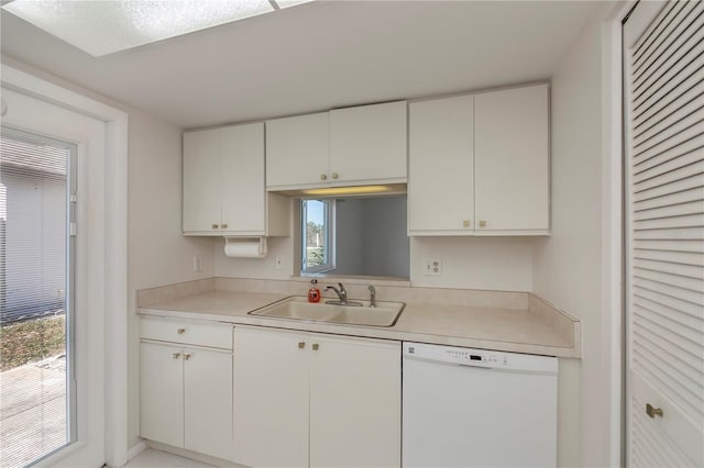 kitchen featuring dishwasher, white cabinets, and sink