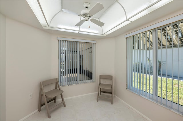 sitting room featuring ceiling fan