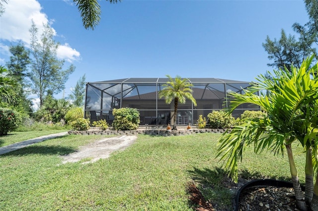 view of yard with glass enclosure