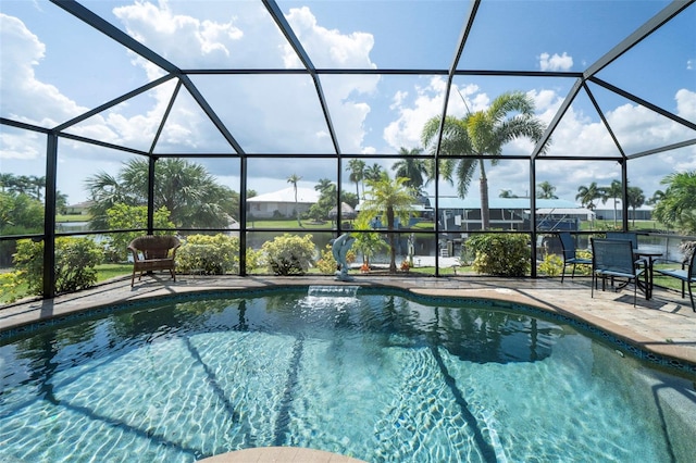 view of swimming pool with a lanai and a patio area