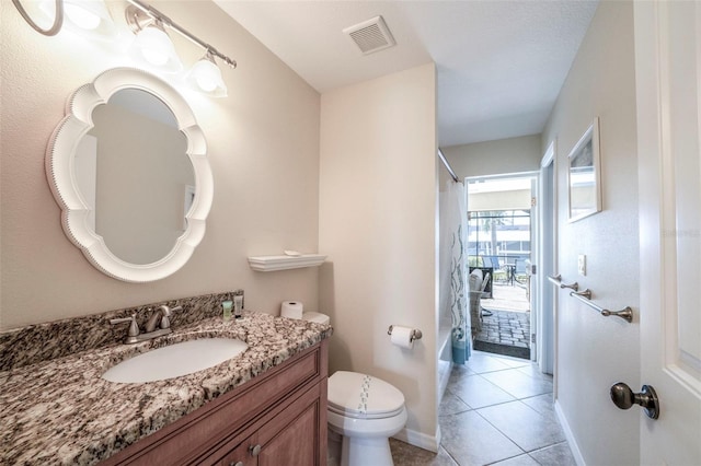 full bathroom featuring tile patterned floors, vanity, shower / bath combination with curtain, and toilet