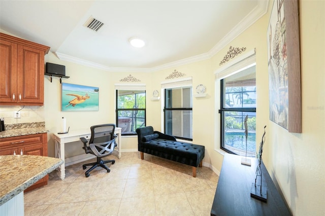 home office featuring light tile patterned floors and crown molding