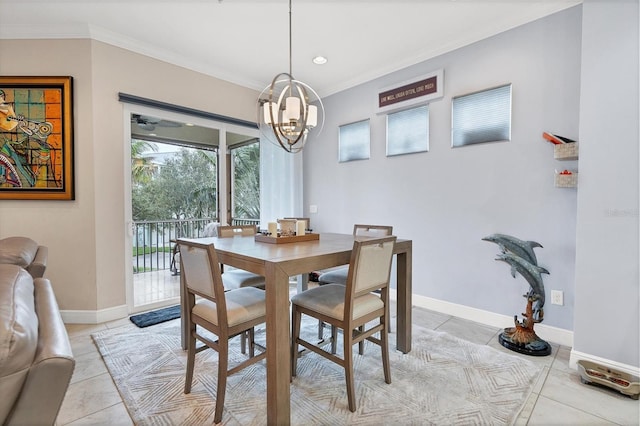 dining space featuring crown molding, light tile patterned flooring, and an inviting chandelier