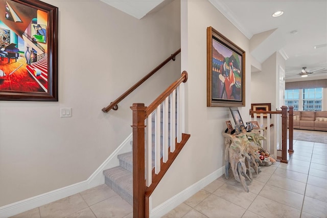 stairway with ceiling fan and tile patterned flooring