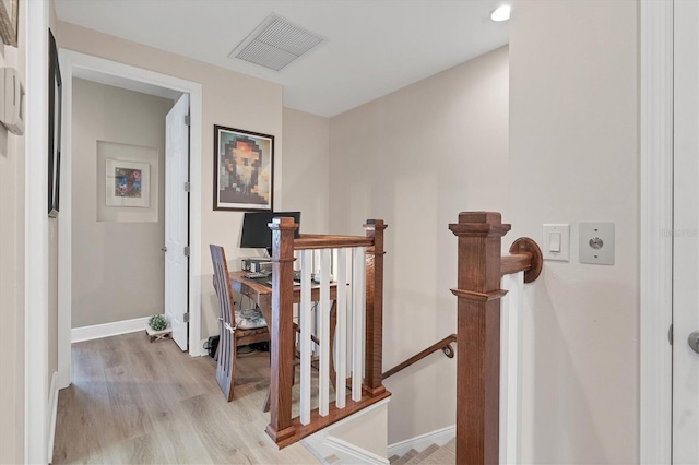 10311 Lands End Cir Unit 13, Placida, FL 33946 - hall with light wood finished floors, an upstairs landing, and baseboards