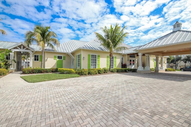 10311 Lands End Cir Unit 13, Placida, FL 33946 - view of front of property featuring a standing seam roof, metal roof, and decorative driveway