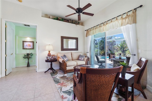 living room with light tile patterned floors and ceiling fan