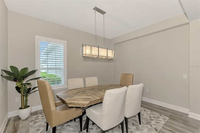 dining room with light hardwood / wood-style floors