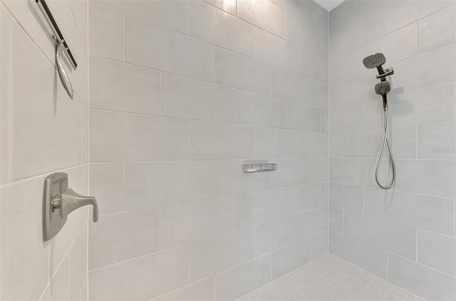 full bath featuring a tile shower