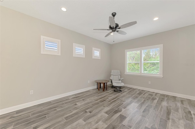 unfurnished room featuring light wood-style floors, baseboards, a ceiling fan, and recessed lighting