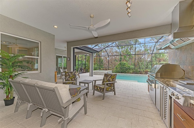 view of patio featuring an in ground hot tub, ceiling fan, an outdoor pool, glass enclosure, and an outdoor kitchen