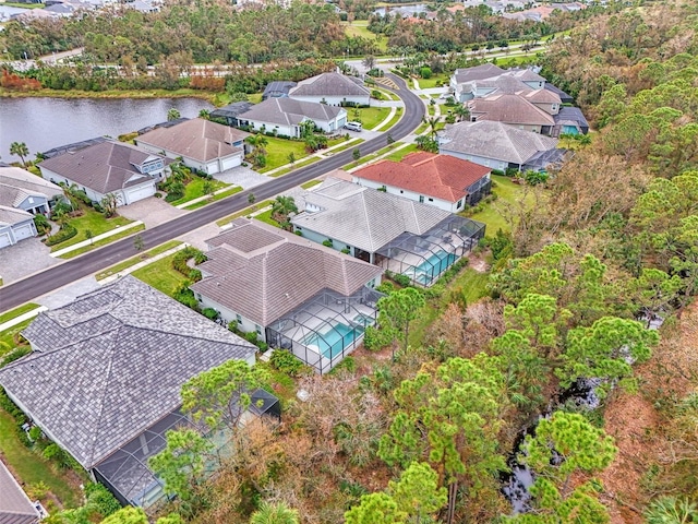 drone / aerial view with a residential view and a water view