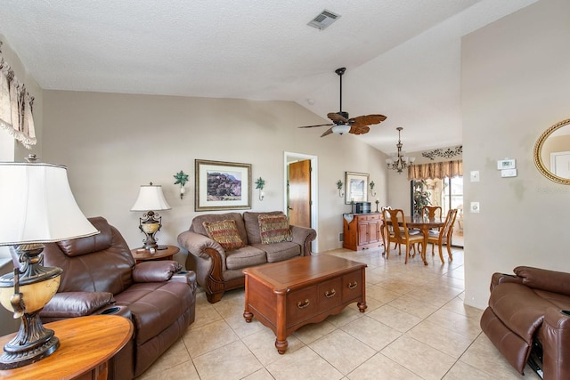 living room featuring a textured ceiling, ceiling fan with notable chandelier, light tile patterned floors, and vaulted ceiling