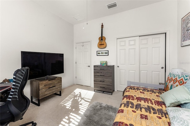 bedroom with light colored carpet