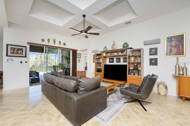 living room with coffered ceiling, light tile patterned floors, ceiling fan, and beam ceiling