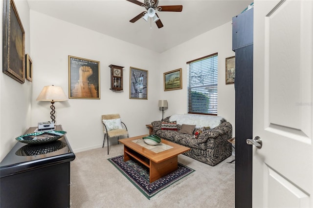 living room featuring carpet flooring and ceiling fan