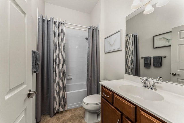 full bathroom featuring shower / tub combo with curtain, vanity, and toilet