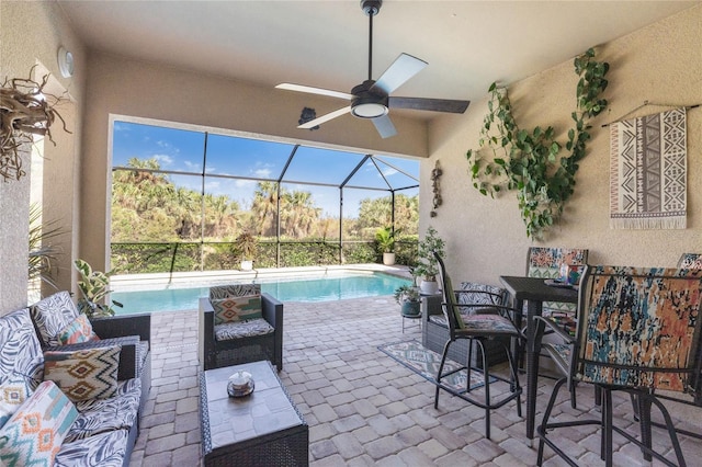 view of patio / terrace featuring a lanai and ceiling fan