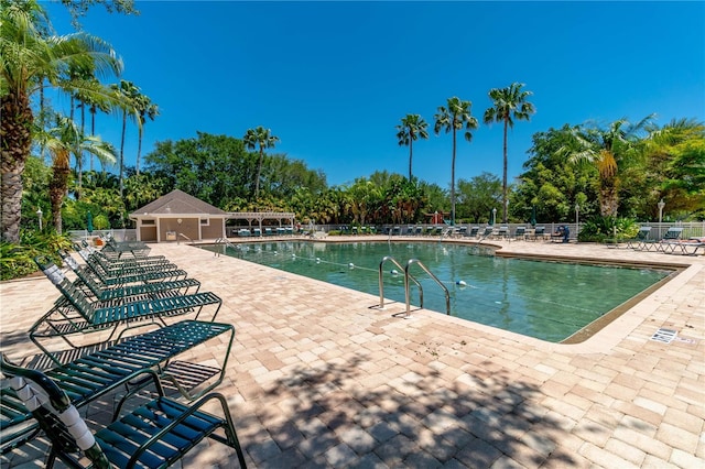 view of swimming pool with a patio area