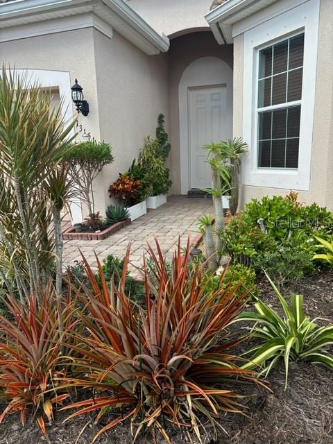 entrance to property with a patio