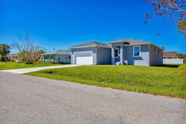 view of front of house with a front lawn and a garage