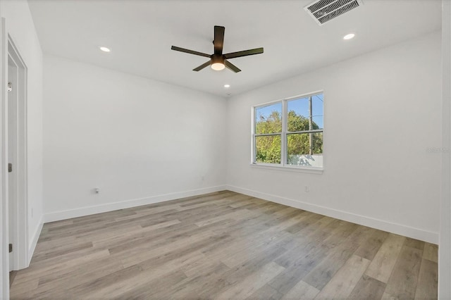 empty room with light hardwood / wood-style floors and ceiling fan