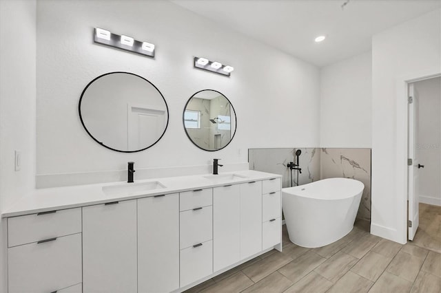 bathroom featuring vanity and a bathing tub