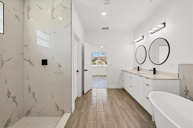 bathroom with vanity and plus walk in shower