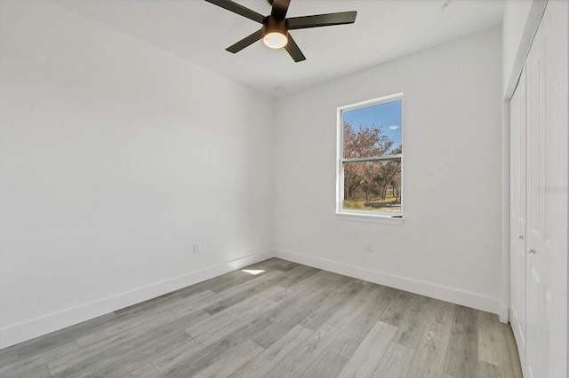 unfurnished room with light hardwood / wood-style flooring and ceiling fan