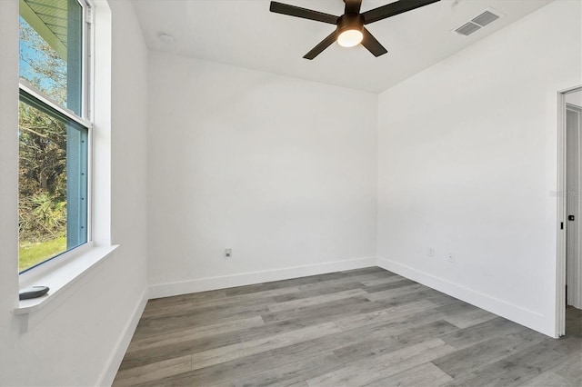 spare room with light hardwood / wood-style floors and ceiling fan