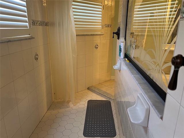 bathroom with tiled shower