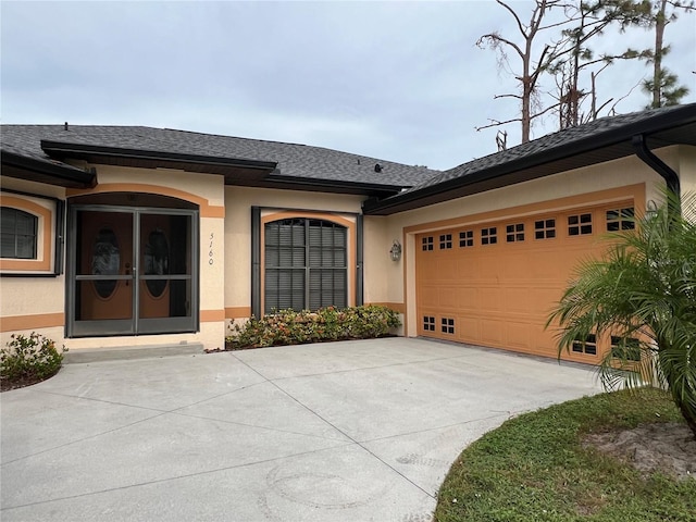 5160 Farewell St, Port Charlotte, FL 33981 - single story home featuring stucco siding, concrete driveway, a garage, and roof with shingles