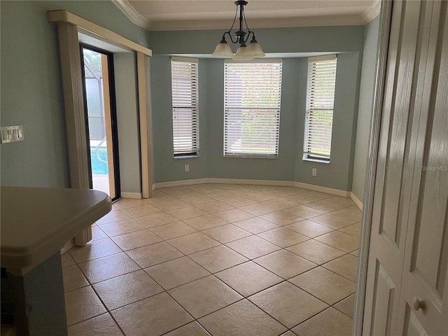 unfurnished dining area featuring crown molding and light tile patterned floors