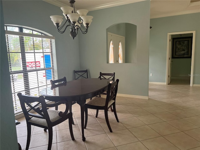 dining room with ornamental molding, light tile patterned floors, and a chandelier