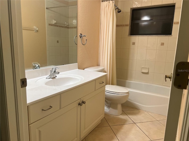 full bathroom with vanity, tile patterned floors, toilet, and shower / tub combo with curtain