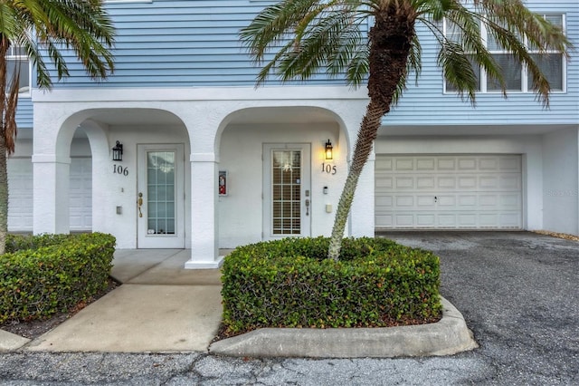 property entrance with a garage