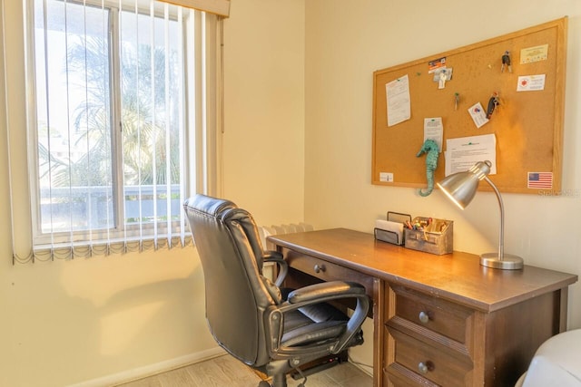 office space with light wood-type flooring