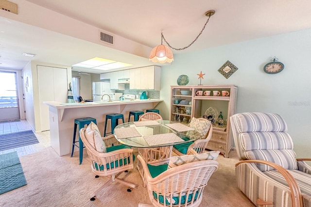 view of carpeted dining area