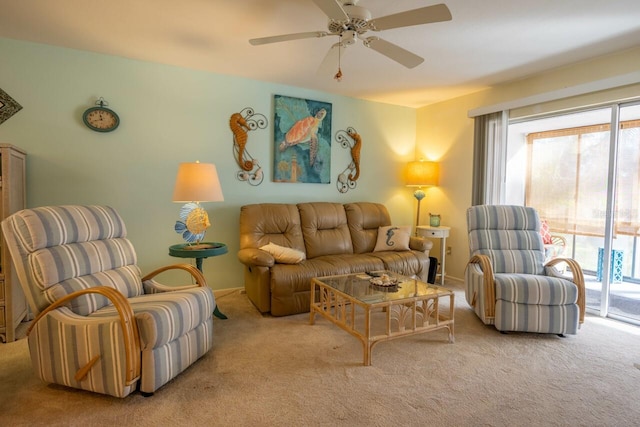 carpeted living room with ceiling fan