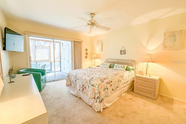 carpeted bedroom featuring access to exterior and ceiling fan