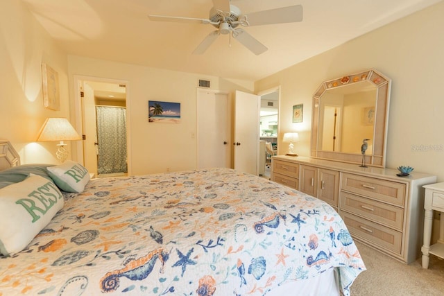 bedroom with ceiling fan and light colored carpet